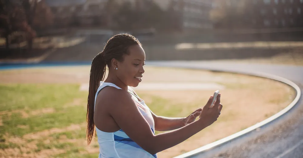 A woman checks her phone